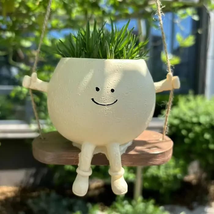 Jardinière de visage de sourire de chaise/balançoire
